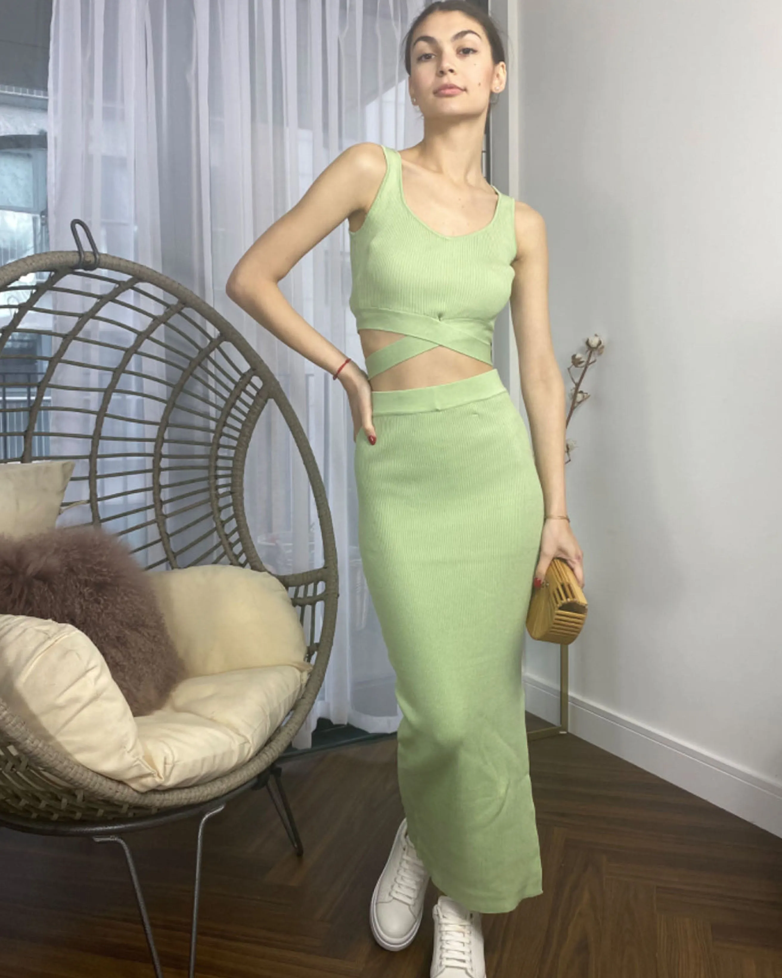 Knitted bodycon style vest top with tie up design and midi pencil skirt co-ords set in green